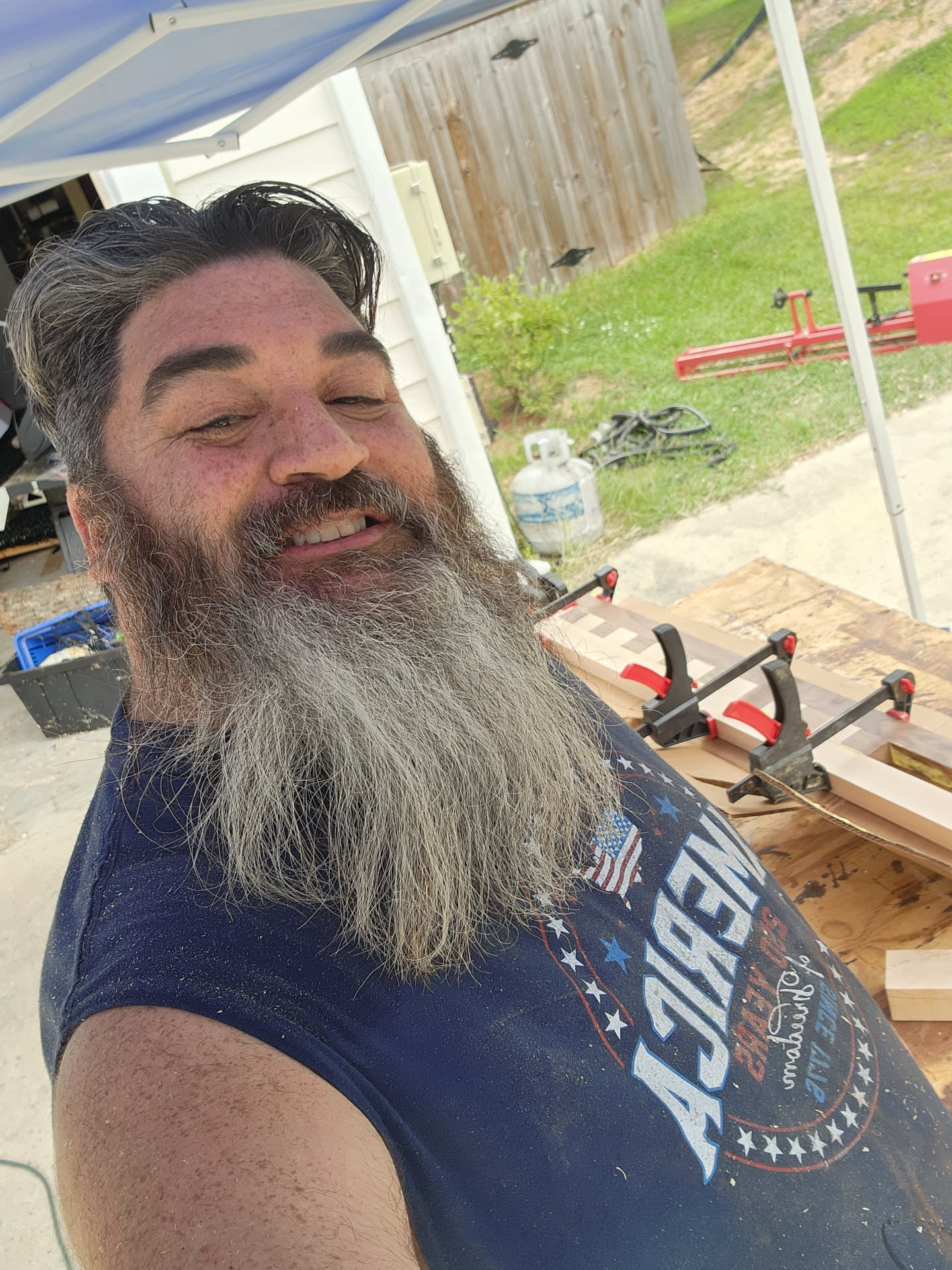 Walnut and maple cutting board blank clamped during glue-up
